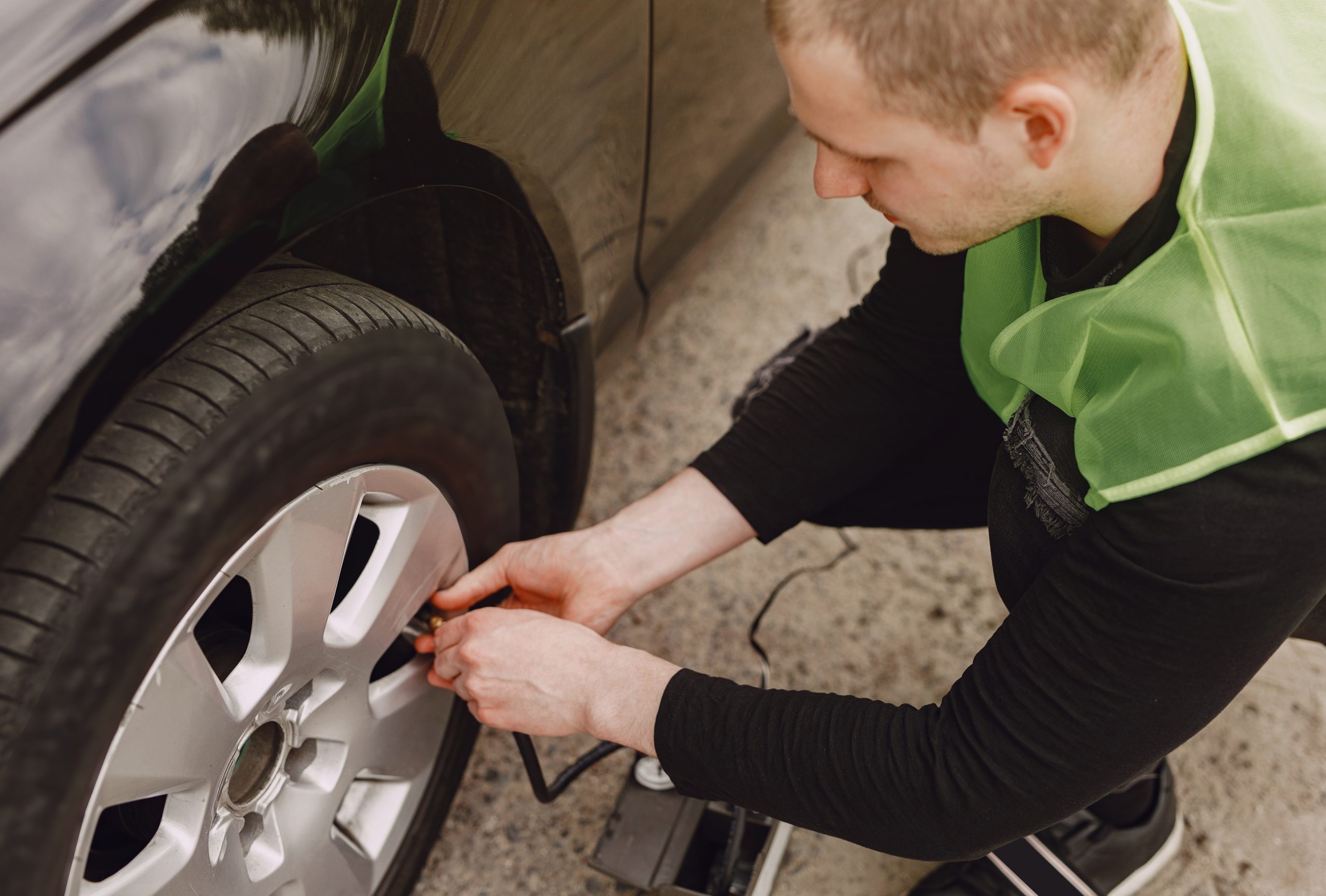 Man changing wheel after a car breakdown